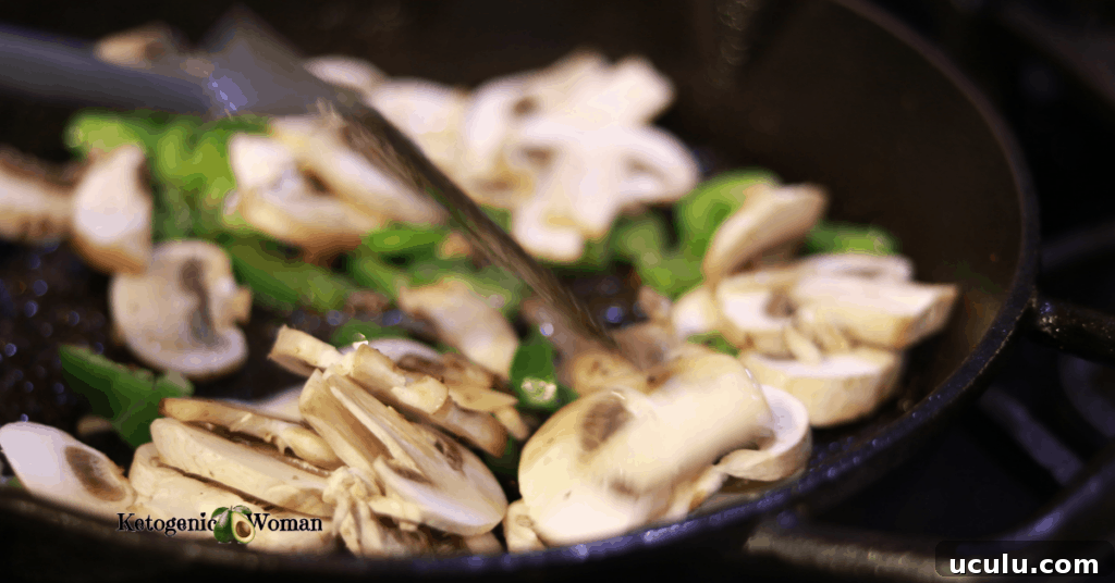 peppers and mushrooms in cast iron pan