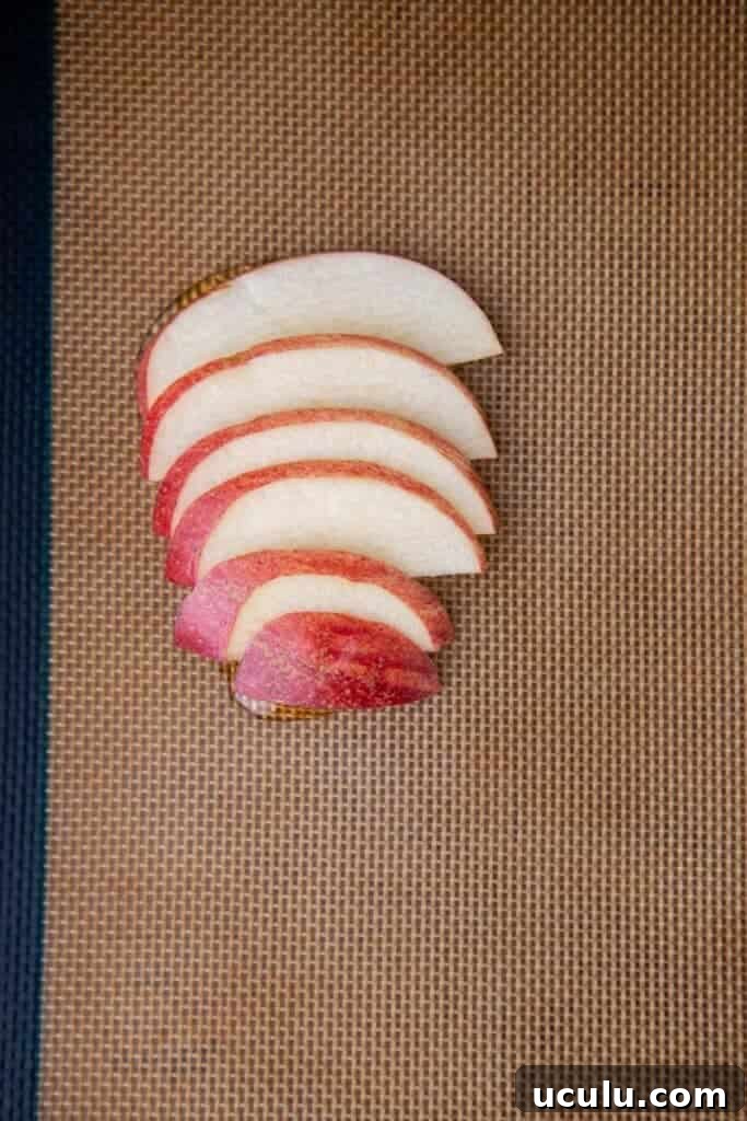 Apple slices on baking sheet