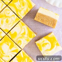 Square pieces of gluten free lemon slice on a pale purple background.
