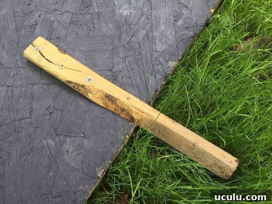 Stake attached with screws.