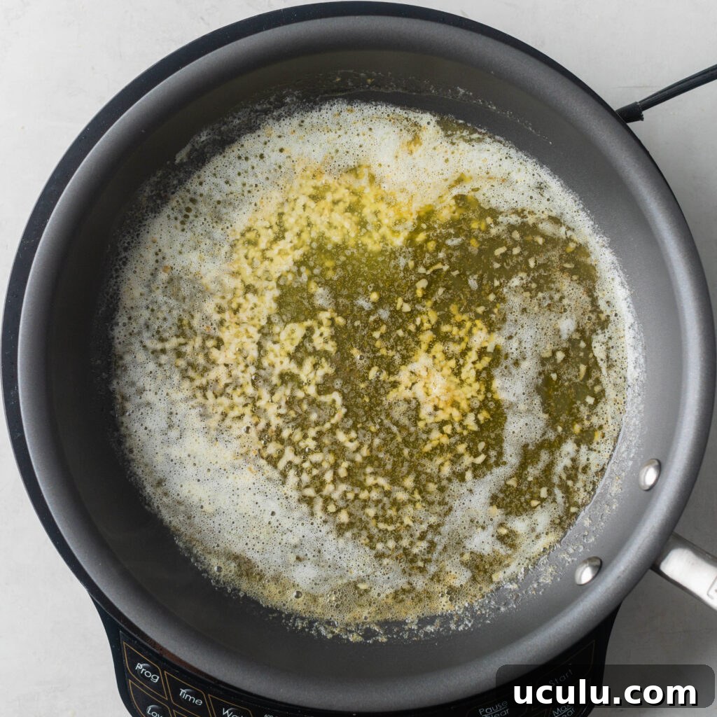 sautéing garlic in melted butter in a non stick skillet.