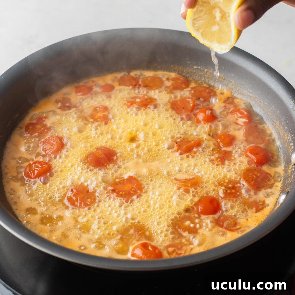 Squeezing lemon juice to simmering sauce.