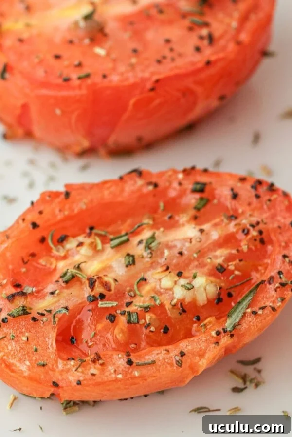 Seasoned and sliced air fried tomato on a white board