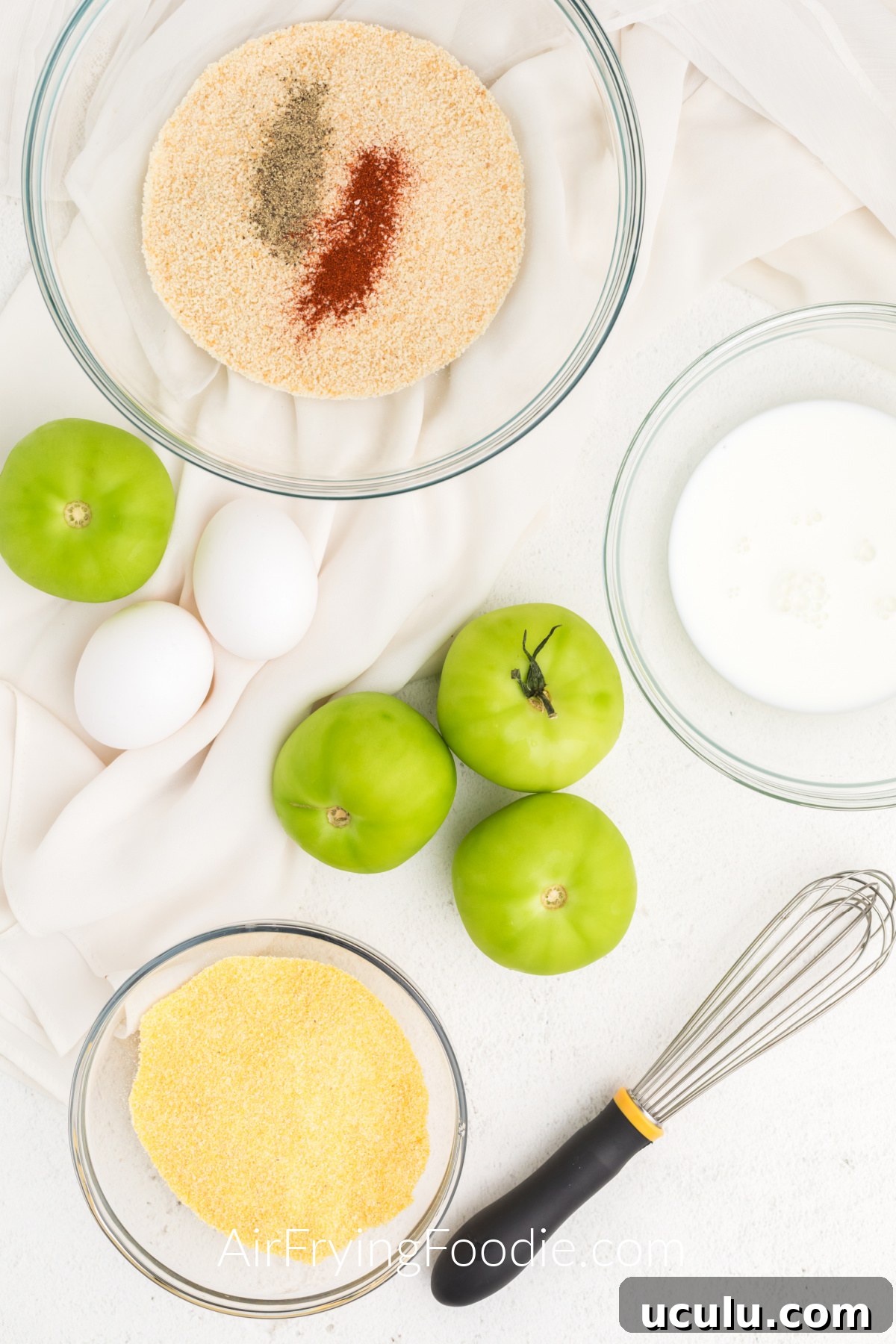Ingredients needed to make fried green tomatoes in the air fryer.