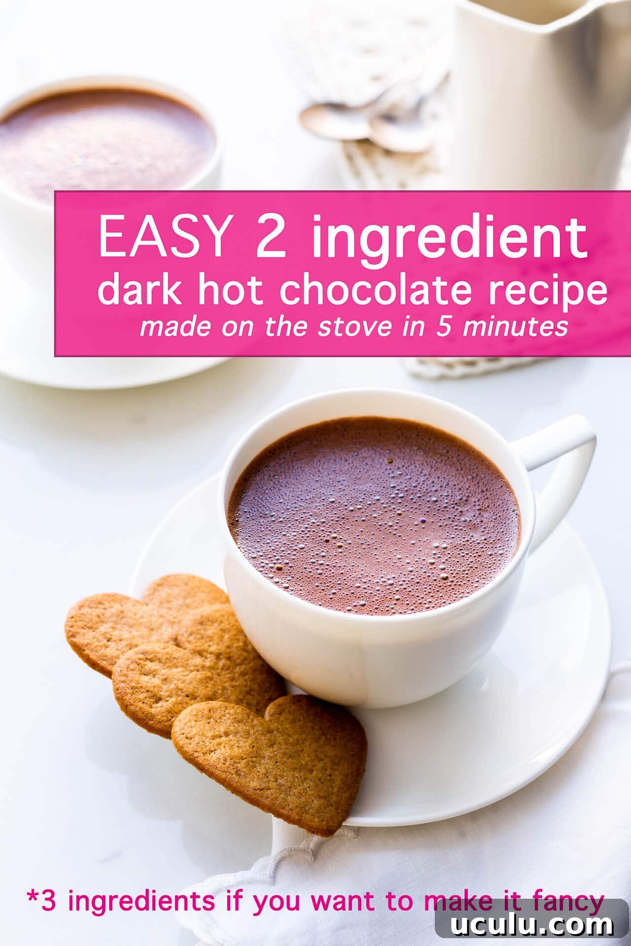 A cup of homemade dark hot chocolate served with heart-shaped cookies for valentine's day drink
