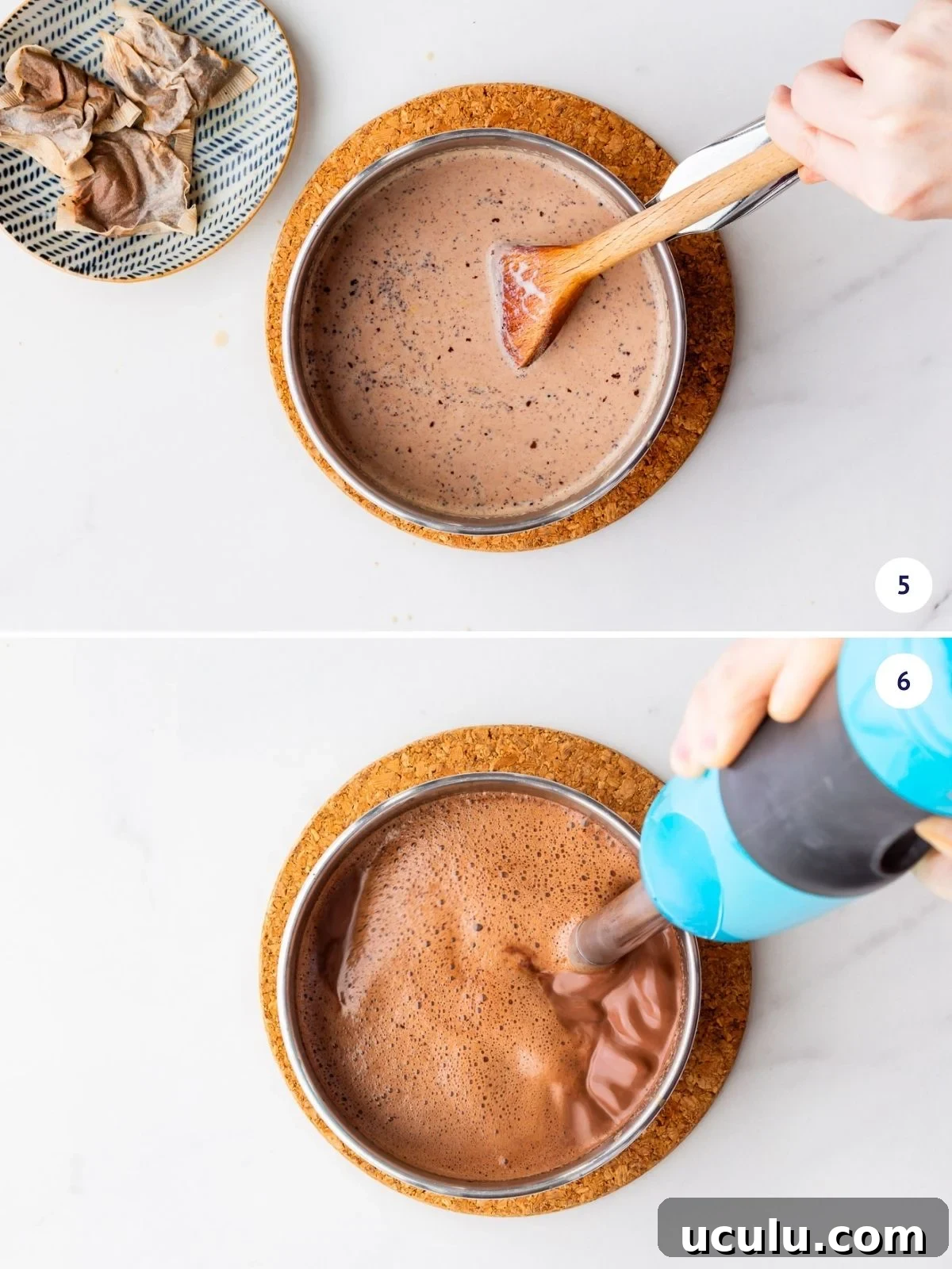 Mixing hot chocolate with an immersion blender to smooth it out and create foam.