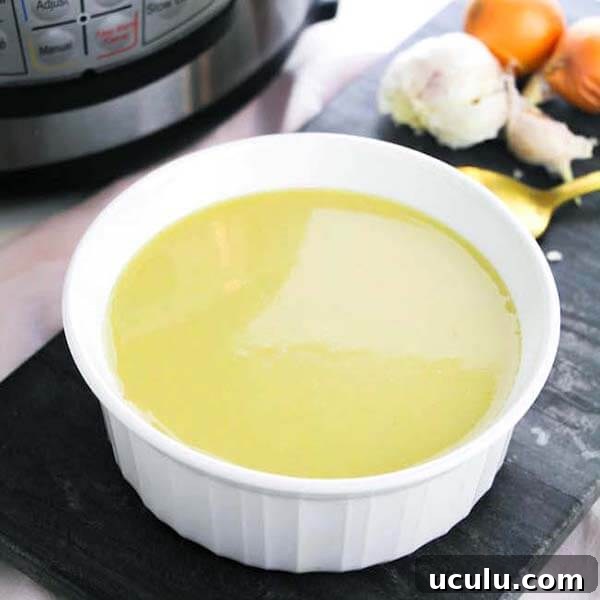 Low-Carb Instant Pot Recipes for Quick Weeknight Meals 20 Keto Asparagus Soup in a white bowl in front of a pressure cooker