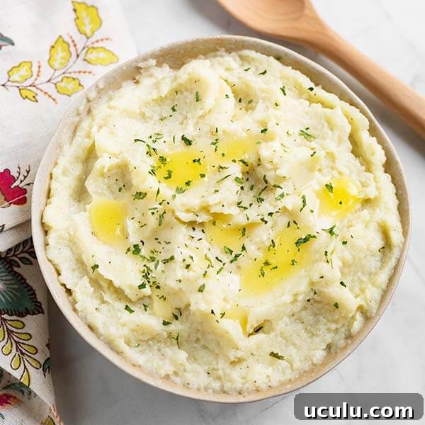 Low-Carb Instant Pot Recipes for Quick Weeknight Meals 22 low carb instant pot mashed cauliflower in a beige bowl topped with melted butter