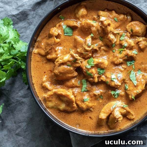 Low-Carb Instant Pot Recipes for Quick Weeknight Meals 7 Low Carb Butter Chicken in a black bolw on top of a gray napkin
