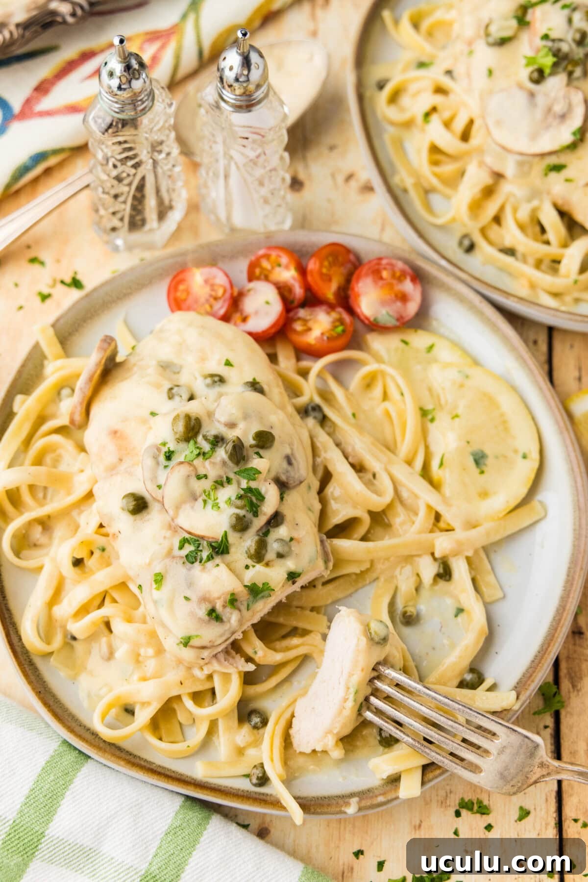 Chicken Scallopini on fettucini on plate