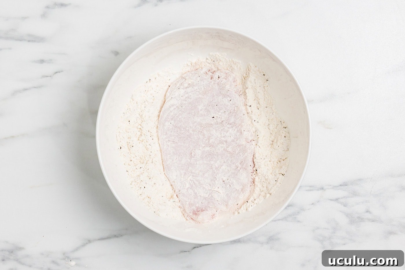 chicken cutlet dredged in flour