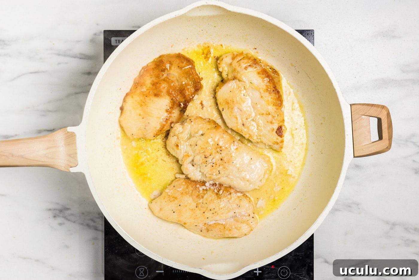 browned chicken cutlets in skillet