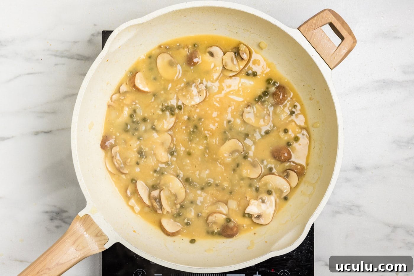 Chicken Scallopini sauce in skillet