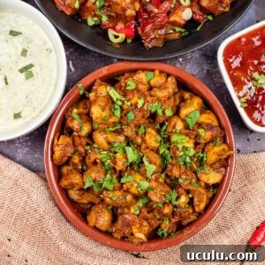 Indian Mushroom Bhaji Recipe | Flavorful Mushroom Curry Guide 3 Mushroom curry in a tapas dish with mint raita, chilli paneer and mango chutney on the side