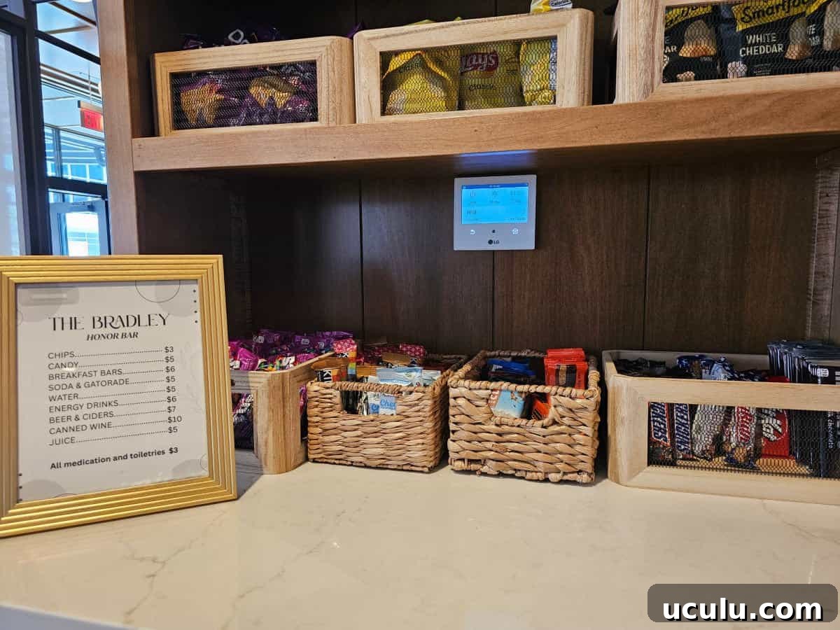 The Bradley Hotel in Fort Wayne, Indiana — Historic Tour Video 14 snacks in baskets next to a The Bradley Honor bar sign with prices