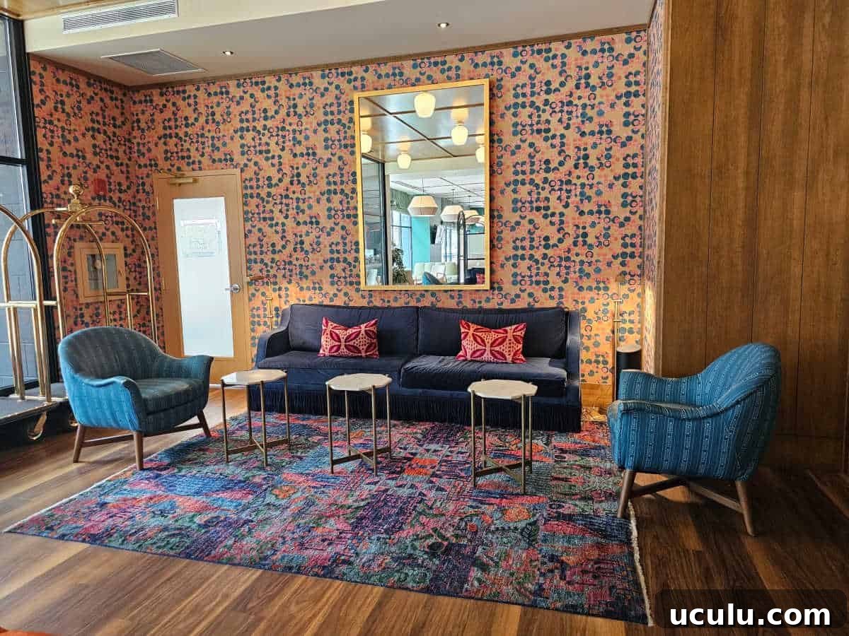 The Bradley Hotel in Fort Wayne, Indiana — Historic Tour Video 3 colorful lobby sitting area with blue couch, blue chairs, and brightly colored wallpaper