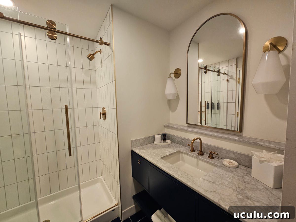The Bradley Hotel in Fort Wayne, Indiana — Historic Tour Video 5 Bathroom with marble sink, mirror, and walk in shower