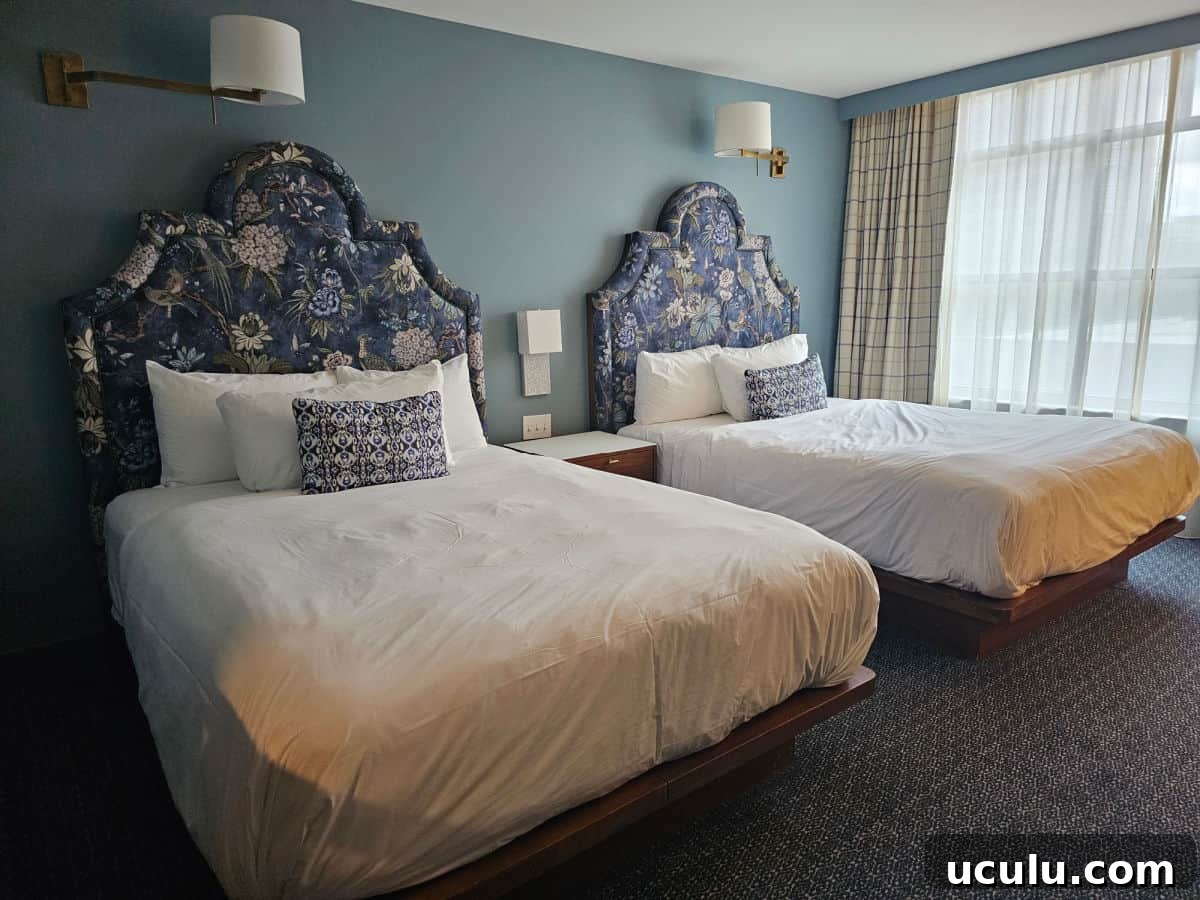 The Bradley Hotel in Fort Wayne, Indiana — Historic Tour Video 6 two queen beds with white linens, blue padded headboard
