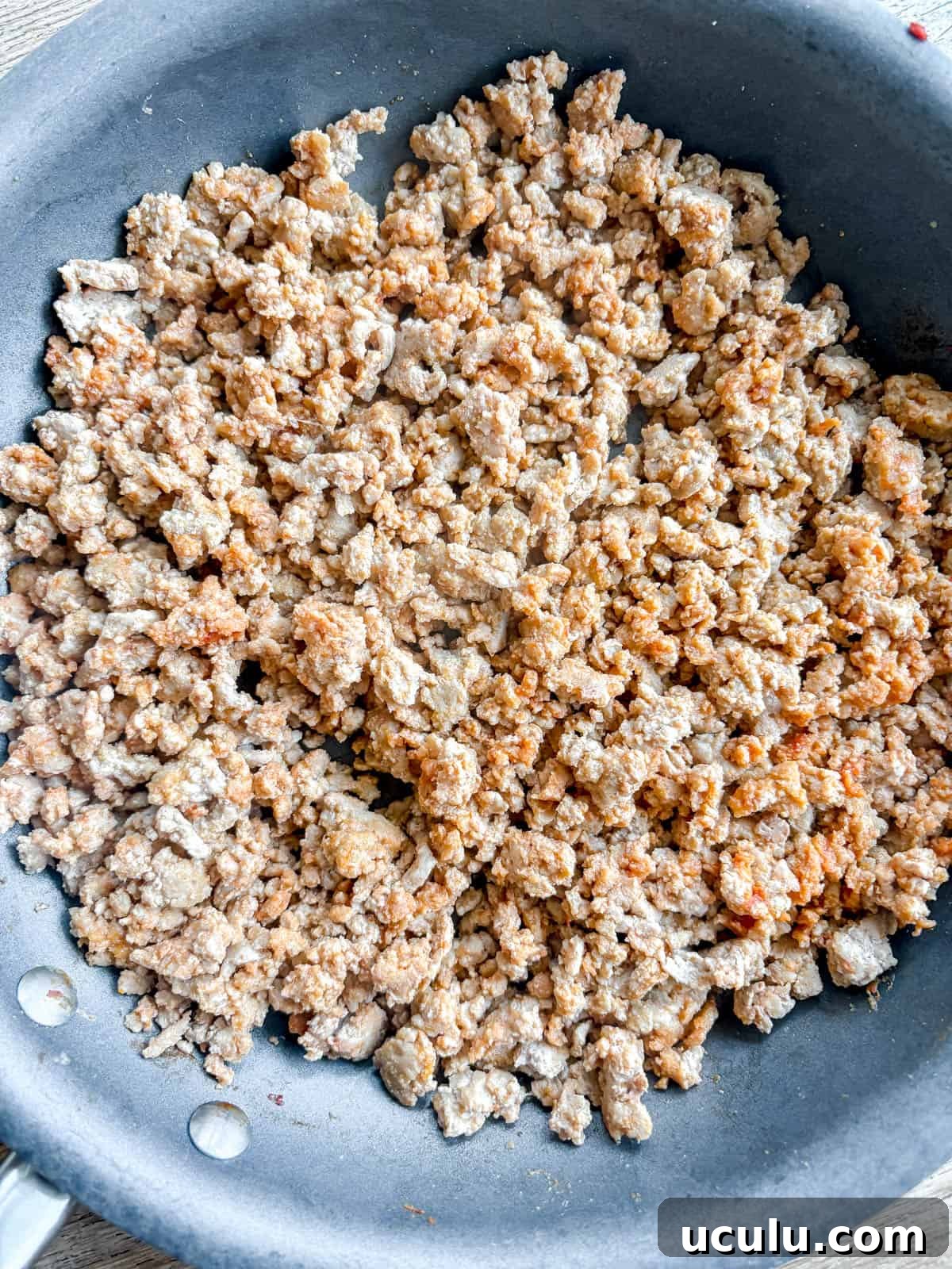 Ground turkey in a pan.