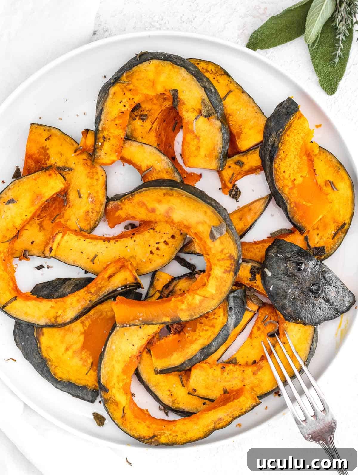 Roasted Kabocha Squash Recipe with Crispy Herb Crust 2 Roasted Kabocha squash on white plate
